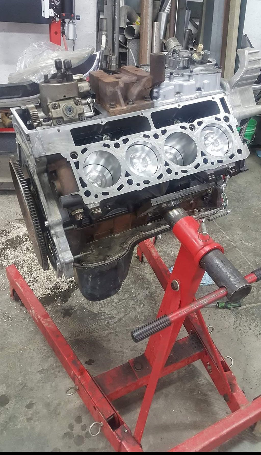 Diesel engine rebuild in progress on an engine stand