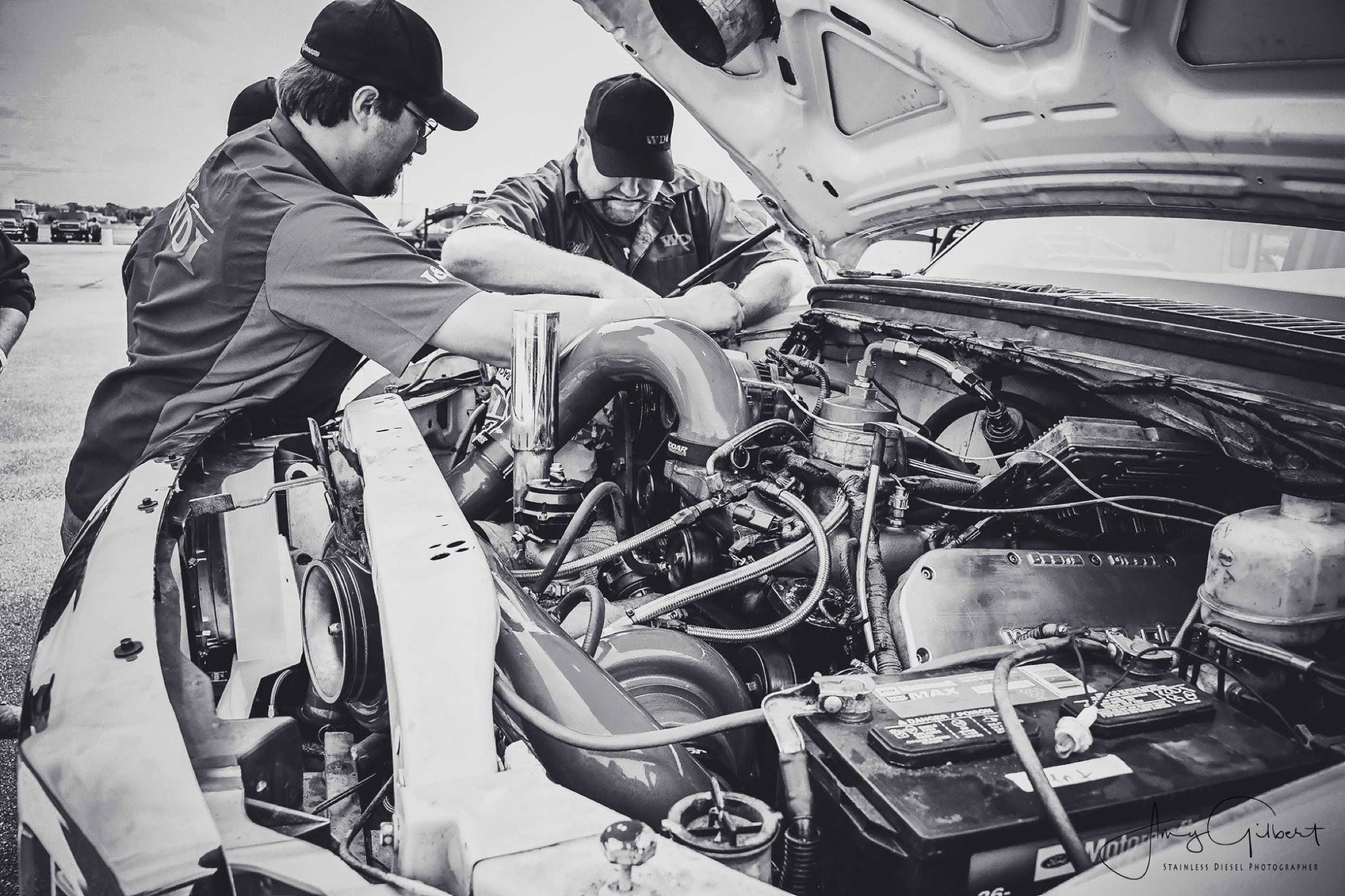 J&J Performance mechanics working under the hood of a diesel truck